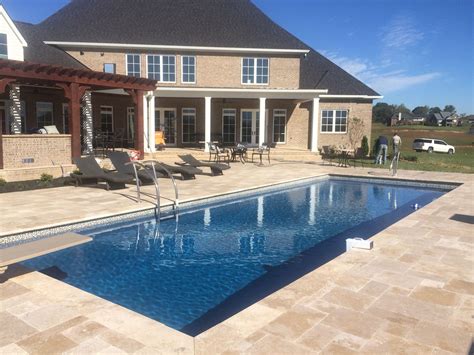 Maybe you would like to learn more about one of these? Blue Hawaiian Athens fiberglass pool with travertine ...