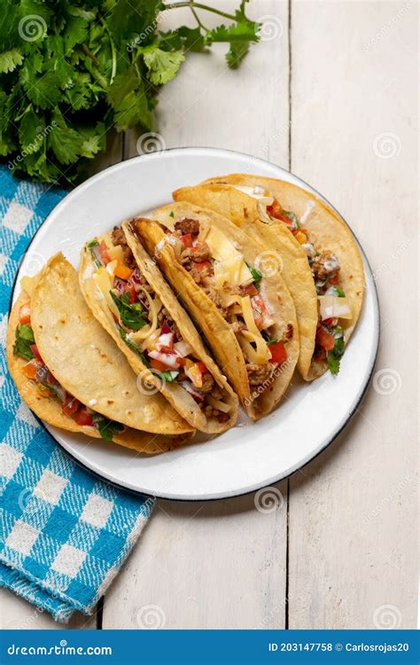 Mexican Hard Shell Tacos With Meat And Fresh Sauce On White Background