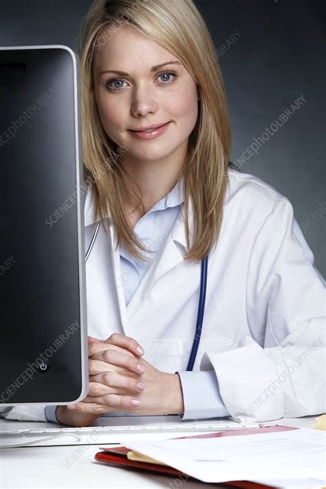 doctor at her desk stock image c009 8827 science photo library