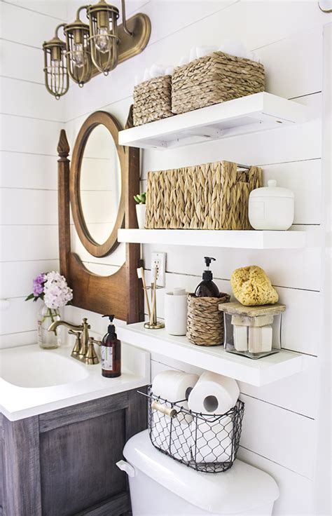We built a pair of floating shelves to store towels and display decor in our guest bathroom. DIY Floating Bathroom Shelves - Shades of Blue Interiors