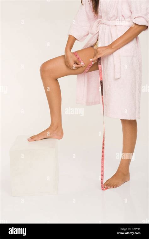 Woman Measuring Her Thigh Stock Photo Alamy