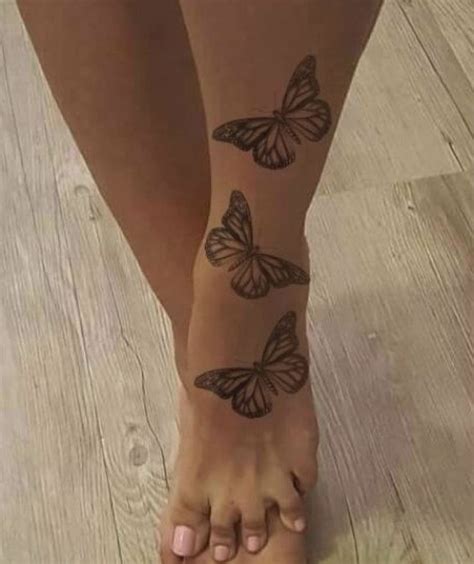 Butterflies Tattoo In 2021 Henna Tattoo Foot Butterfly Ankle Tattoos