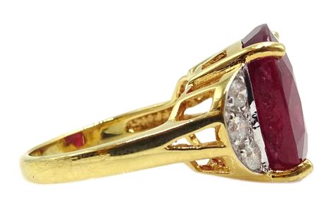 18ct gold oval ruby ring with three diamonds set each side hallmarked ruby approx 10 5 carat