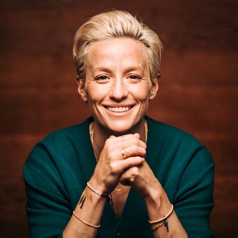 Megan rapinoe, wearing a thom browne suit, poses for a picture before the marriage ceremony if ali krieger and ashlyn harris. Megan Rapinoe to deliver 41st Bucksbaum lecture at Drake University - Drake University Newsroom