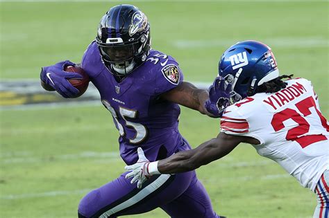 Check the detailed information on gus edwards, rb baltimore ravens player: Gus Edwards is going to stay with the Ravens 'one way or ...