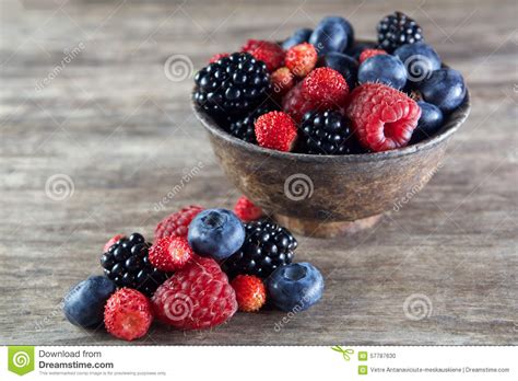 Assorted Berries In Bowl On Wood Stock Photo Image Of Closeup Heap