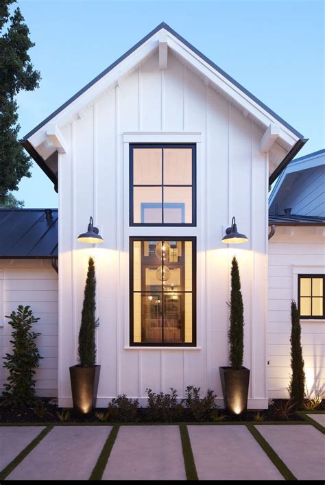 White Board And Batten Siding And Black Window Frames With Thin