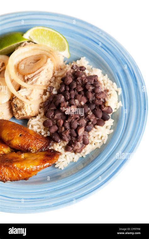 Traditional Cuban Meal Of Roast Pork Black Beans And Rice And Sweet