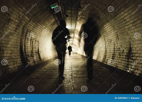 Two People Walking In The Tunnel Stock Image Image Of Architecture