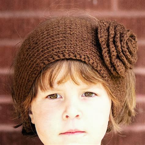 A Free Pattern For A Knit Ear Warmer Pattern With Flower The Flower Is