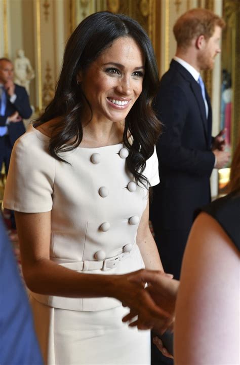 Meghan Duchess Of Sussex Wears Prada To Buckingham Palace Event