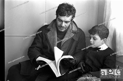 Egyptian Actor Omar Sharif Reading The Plot Of The Film Doctor Zhivago Beside His Son Tarek