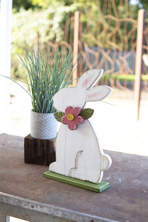 painted wooden rabbit  red flower