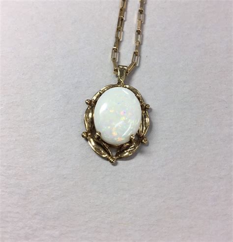 Opal 9ct Gold Oval Pendant And Chain Traditional