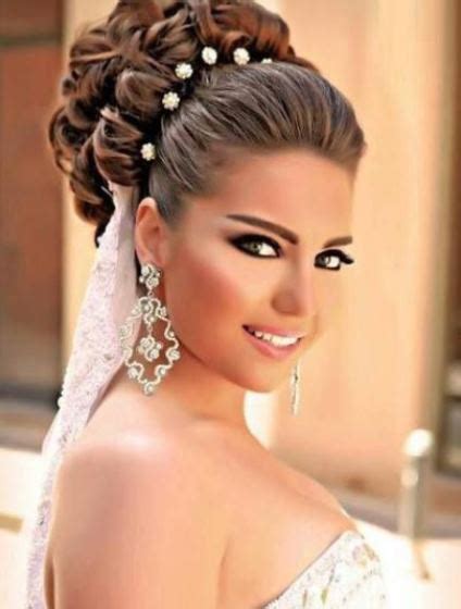 One of the easy updos for medium hair you can try out any time is braiding two bigger strands on each side and bringing them together for a cute half up, half down look. 15 Chic Wedding Hair Updos for Elegant Brides
