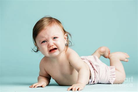 Crawling Baby Girl Crying On The Floor Photograph By