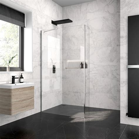 A Modern Bathroom With Marble Walls And Flooring Including A Walk In Shower