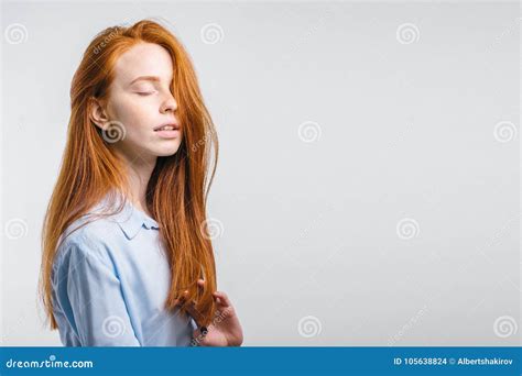 Attractive Redhead Girl Closed Eyes And Open Mouth On White Background