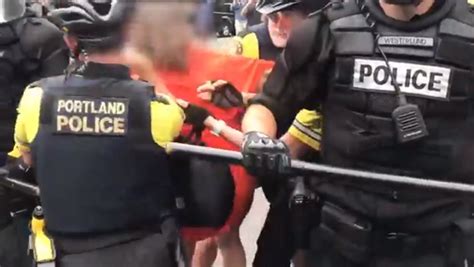 Portland Protests Woman Pinned To Ground By Police Officers After Spitting Towards Them The