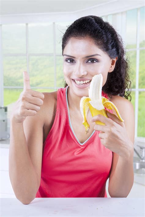 Pretty Woman Holds Banana In Kitchen Stock Image Image Of Asian