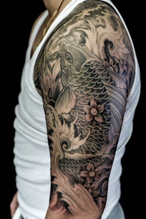 Koi fish tattoos are derived from real koi fishes that have a fascinating history and mythology and blue koi fish tattoos are reserved for the son in a japanese family. Half sleeve Koi Fish tattoo - Chronic Ink