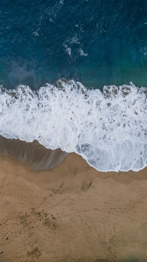 Download Wallpaper 720x1280 Sea Beach Aerial View Wave Water Sand