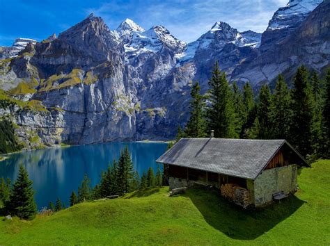 House On Mountain Lake In Switzerland