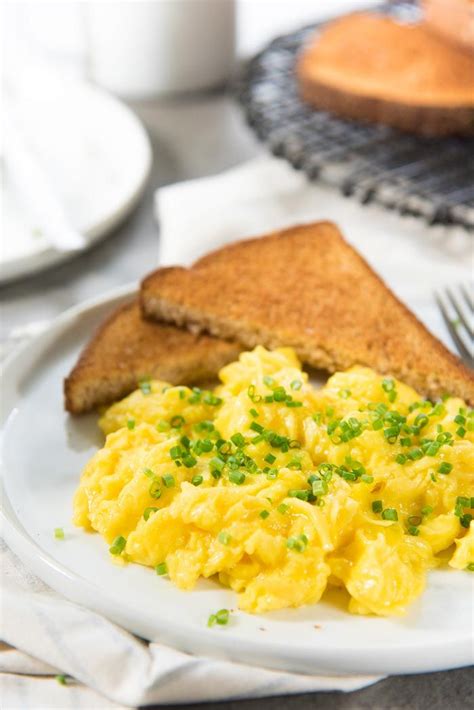 A Close Up To Show How Fluffy And Creamy These Perfect Scrambled Eggs