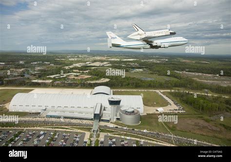 Space Shuttle Discovery Mounted Atop A Nasa 747 Shuttle Carrier