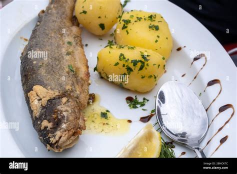 Fresh Hallstatt Trout And Potatoes Recipe On The White Dish At