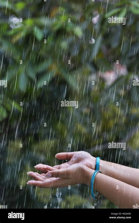 Woman Hand With Bangles Enjoying Rain In Outdoor Stock Photo Alamy