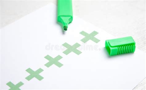 Green Marker And Plus Symbols On White Paper Stock Image Image Of