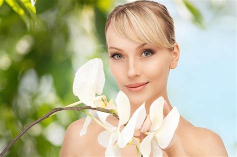 premium photo picture of beautiful woman with orchid flower