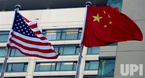 Photo American And Chinese Flags Fly Together In Beijing China