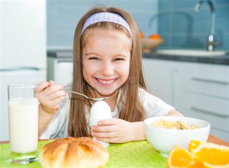 Little Girl Eating Her Breakfast Stock Image Image Of Cheerful
