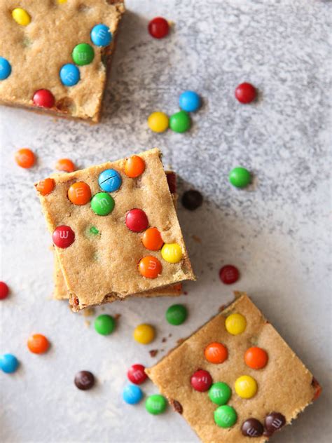 This man of mine loves peanut butter. Peanut Butter M&M Cookie Bars - Completely Delicious