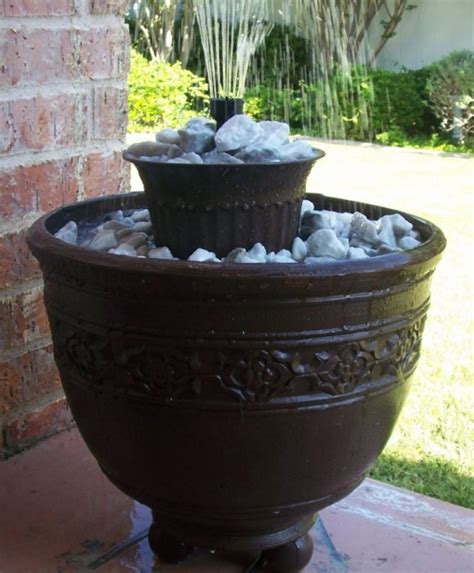 By using ceramic pots of different sizes, you can create a grouping of plants around your fountain. How to Turn Broken Flower Pots Into Incredible Water Fountain