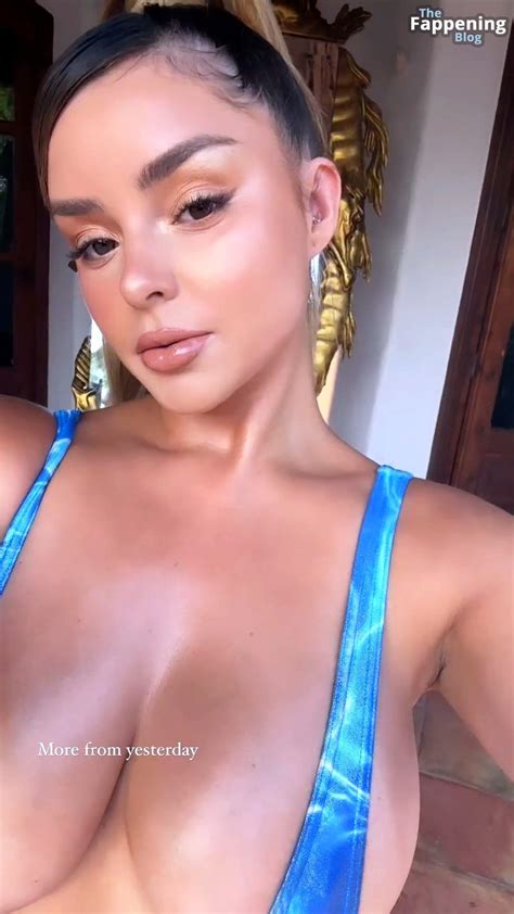 Demi Rose Shows Off Her Jaw Dropping Curves In A Figure Hugging Dress