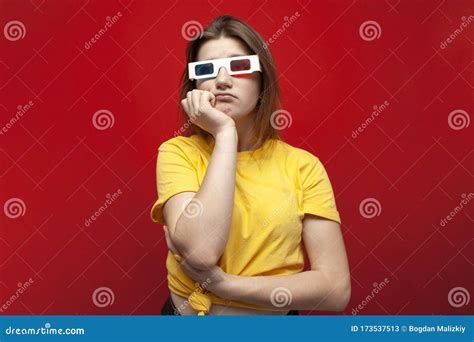 Sad Young Girl Watching A Bad Boring Movie In 3d Glasses And With