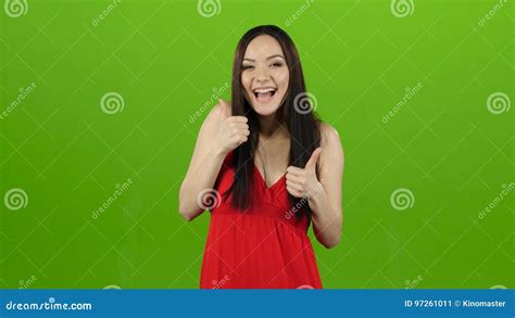 Girl In The Spacious Room Is Having Fun And Showing A Thumbs Up Green Screen Stock Video