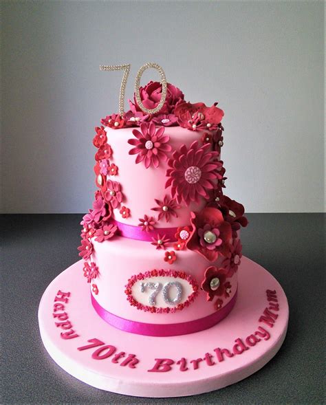 Then & now party invites. Pink flowery two tier 70th birthday cake | Birthday cakes ...