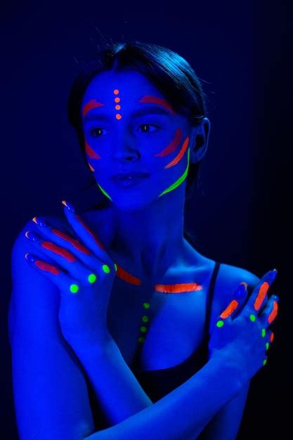 Premium Photo Girl With Ultraviolet Makeup In Neon Light