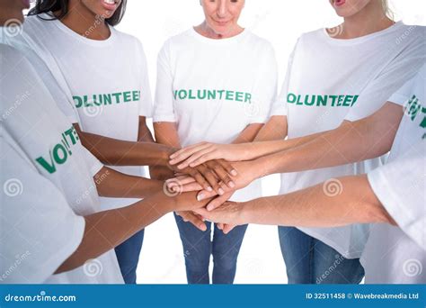 Group Of Female Volunteers With Hands Together Royalty Free Stock