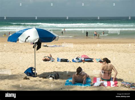 Sunbathers Relaxing On Manly Beach New South Wales Australia Stock