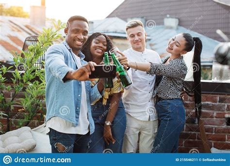 Mixed Race Friends Taking Selfie On Smartphone During Party Stock Image Image Of Group