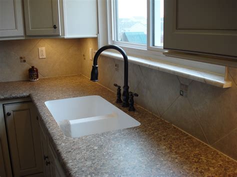 Order your countertop from a manufacturer that produces laminate countertops. 12" x 12" tile backsplash with inserts. Edge sink ...
