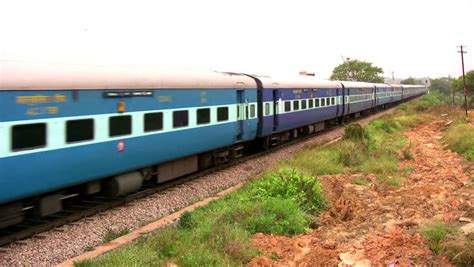 Indian Passenger Train Passes By Suburbs Of Bangalore Karnataka India