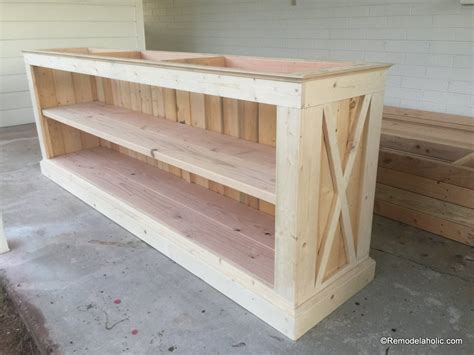 Apply wood glue to the ends of the rails and place between the two legs at the line you drew in the last step. Remodelaholic | Build a Farmhouse TV Console/Sideboard