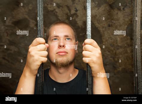 Young Man Behind The Bars Stock Photo Alamy