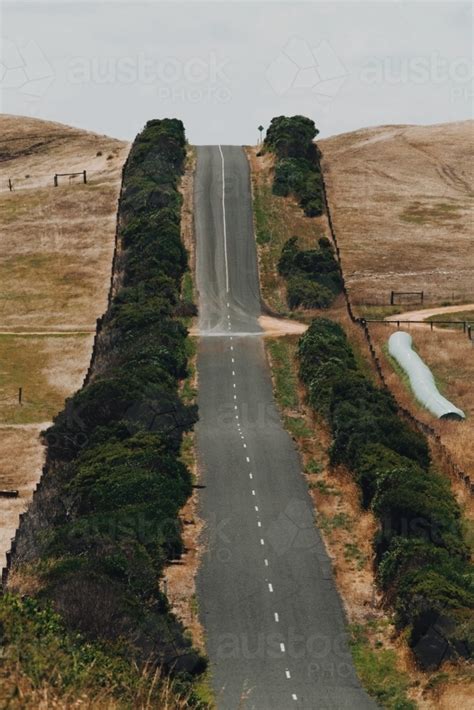 Image Of A Steep Road Between Farming Land Austockphoto